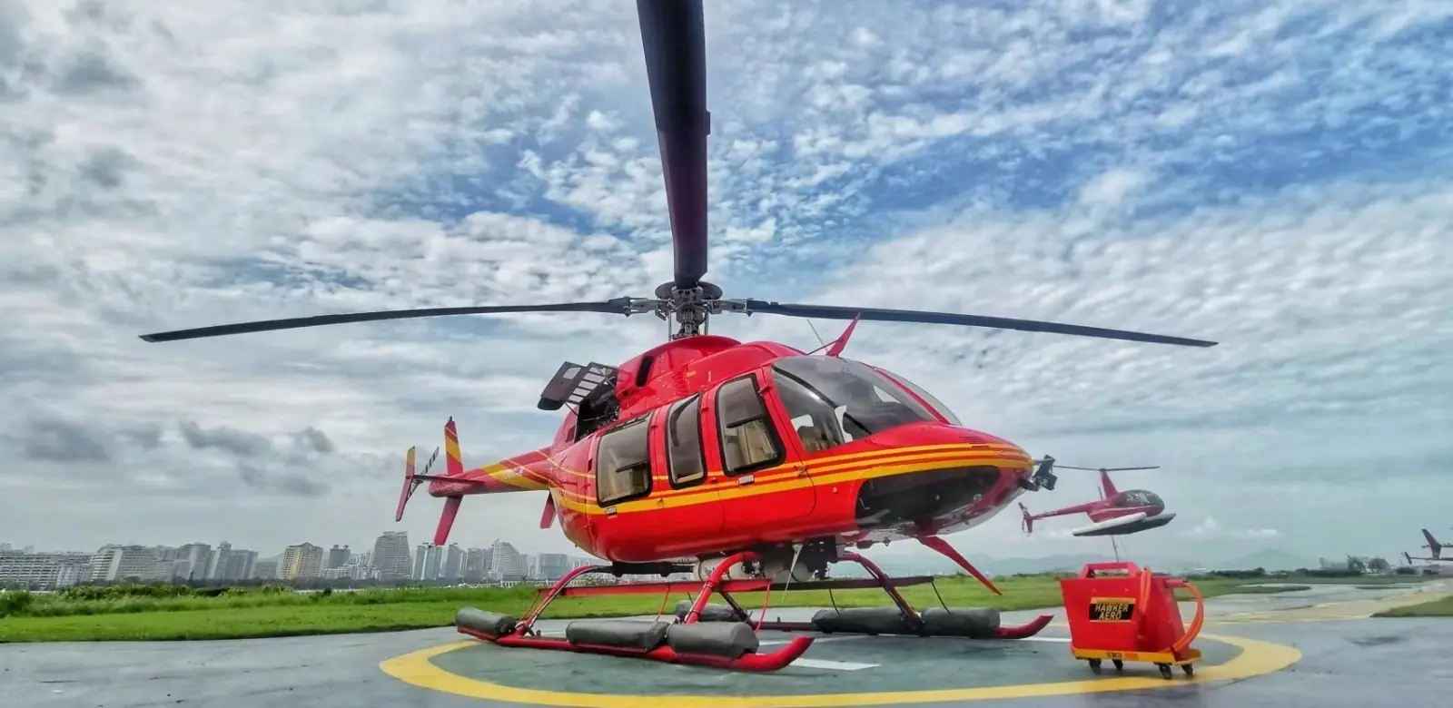 Hawker Aero GPU connected to a helicopter on the ramp